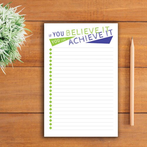 believe it large notepad sitting on a table
