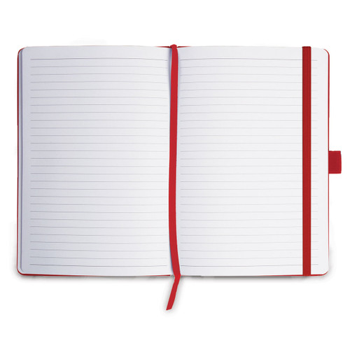 opened journal with red satin ribbon bookmark and lined paper