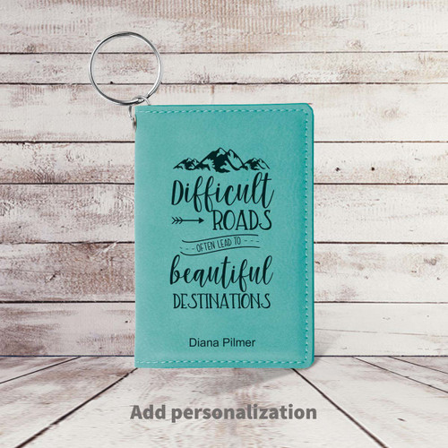 teal leather id card holder with difficult roads message