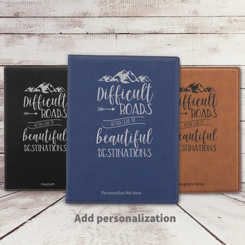 black, blue, and rawhide leather padfolios featuring Beautiful Destinations message