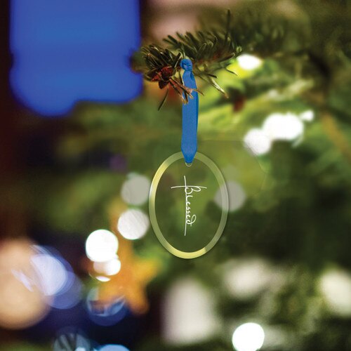 oval crystal ornament with blessed message and blue ribbon