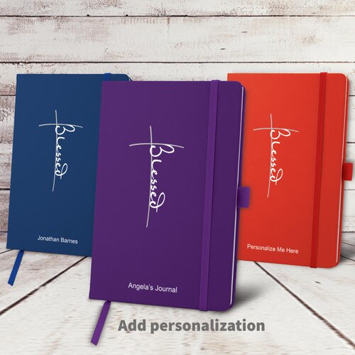 blue, purple, and red hardbound journals with Blessed message and personalization