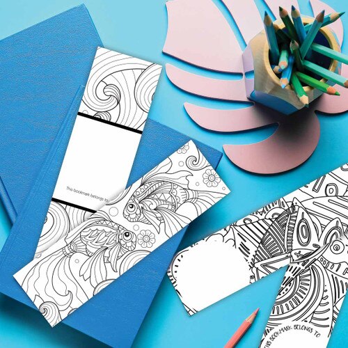 goldfish coloring bookmark laying on a desk