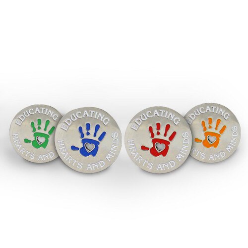 4 colors of the educating hearts and minds lapel pin