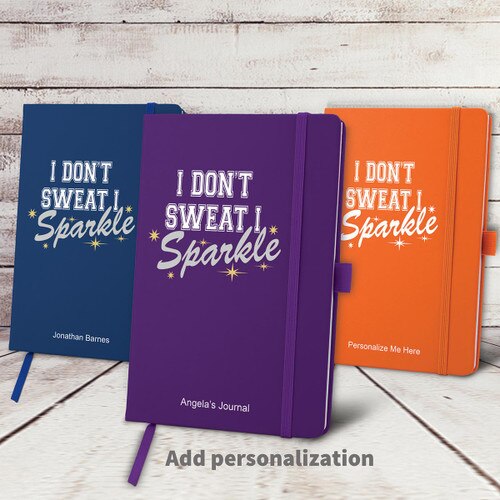 blue, purple, and orange hardbound journals with I Don't Sweat message and personalization