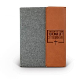 This Canvas/Vegan Leather Padfolio With Notepad Features The Inspirational Message “Life Doesn’t Get Easier You Just Get Stronger”