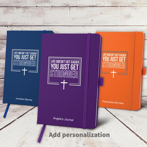 blue, purple, and orange hardbound journals with Life Doesn't Get Easier faith message and personalization