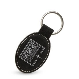 This Leather Oval Keychain With Metal Keyring Features The Inspirational Message “Life Doesn’t Get Easier You Just Get Stronger”