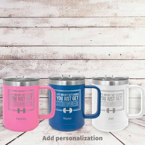pink, blue and white insulated coffee mugs with Life Doesn't Get Easier strength message