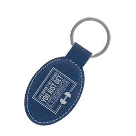 This Vegan Leather Oval Keychain With Metal Keyring Features The Inspirational Message “Life Doesn’t Get Easier You Just Get Stronger”