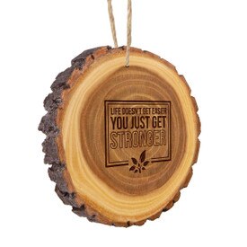 This Rustic Wood Slice Ornament Features The Inspirational Laser Engraved Message “Life Doesn’t Get Easier You Just Get Stronger”