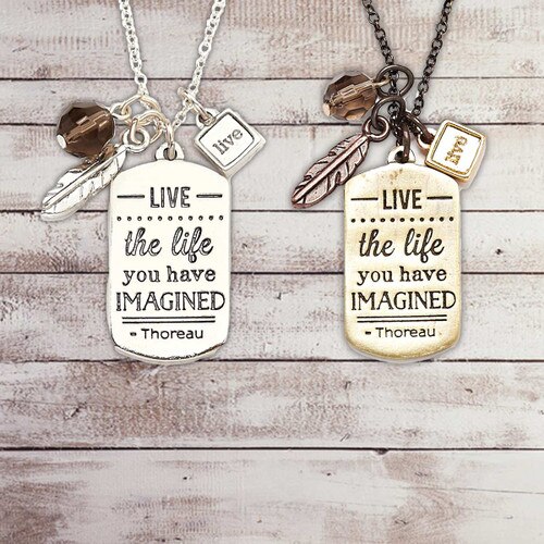 gold and silver necklace with live the life message