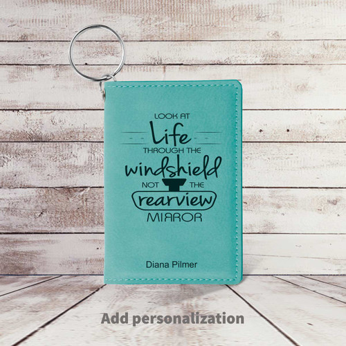 teal leather id card holder with look at life message