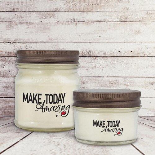 two white candle in glass jar with make today amazing message
