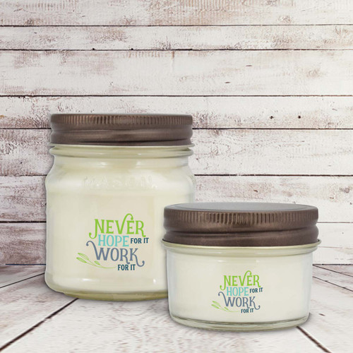 two white candle in glass jar with never hope for it message