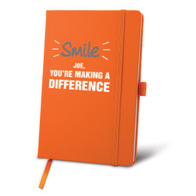 orange journal with smile you're making a difference message and personalization