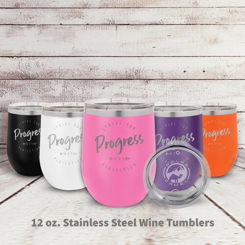 multiple colors of stainless steel stemless wine tumblers with Strive For Progress message