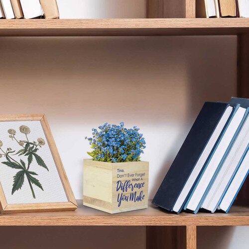 what a difference wooden cube sitting on a shelf